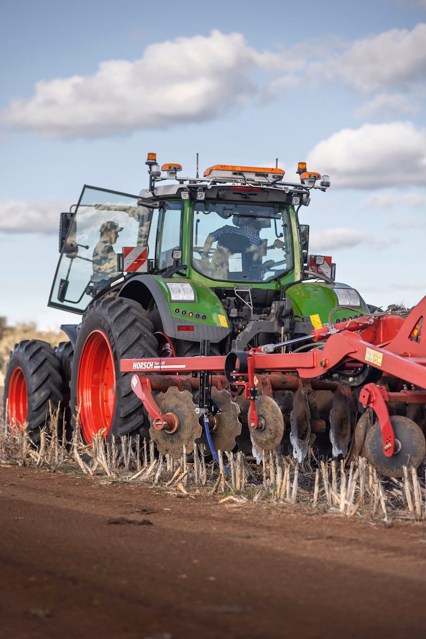 A Fendt tractor fitted with the OutRun autonomy kit, pulling a Horsch Tiger MT disc implement through stubble